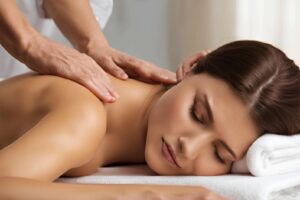 Massage therapist providing a relaxing therapeutic massage to a woman at Hands On HealthCare Massage Therapy in Commack, Long Island