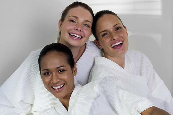 A group of women feeling relaxed and refreshed after a spa party at Hands On HealthCare Massage Therapy in Commack, Long Island.