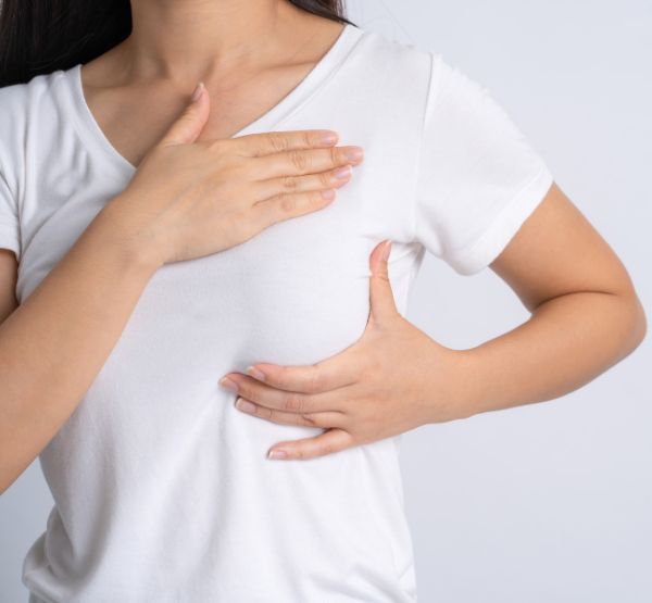 A woman demonstrating self-care practices for the lymphatic system, featured by Hands On HealthCare Massage Therapy in Commack, Long Island.