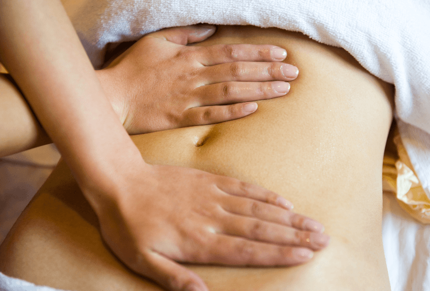 A therapist performing gentle Manual Lymph Drainage therapy on a client at Hands On HealthCare Massage Therapy in Commack, Long Island.