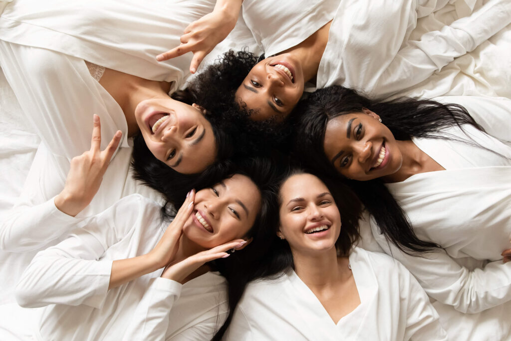 A group of women having a great time at a spa party hosted by Hands On HealthCare Massage Therapy in Commack, Long Island.