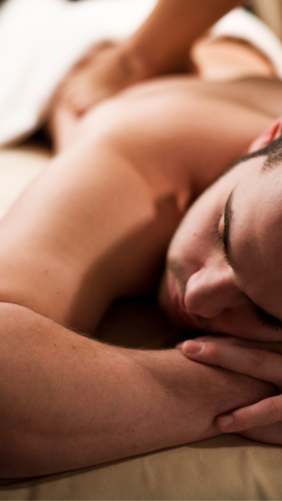 A man receiving a massage at Hands On HealthCare Massage Therapy, illustrating the difference between medical and therapeutic massage.